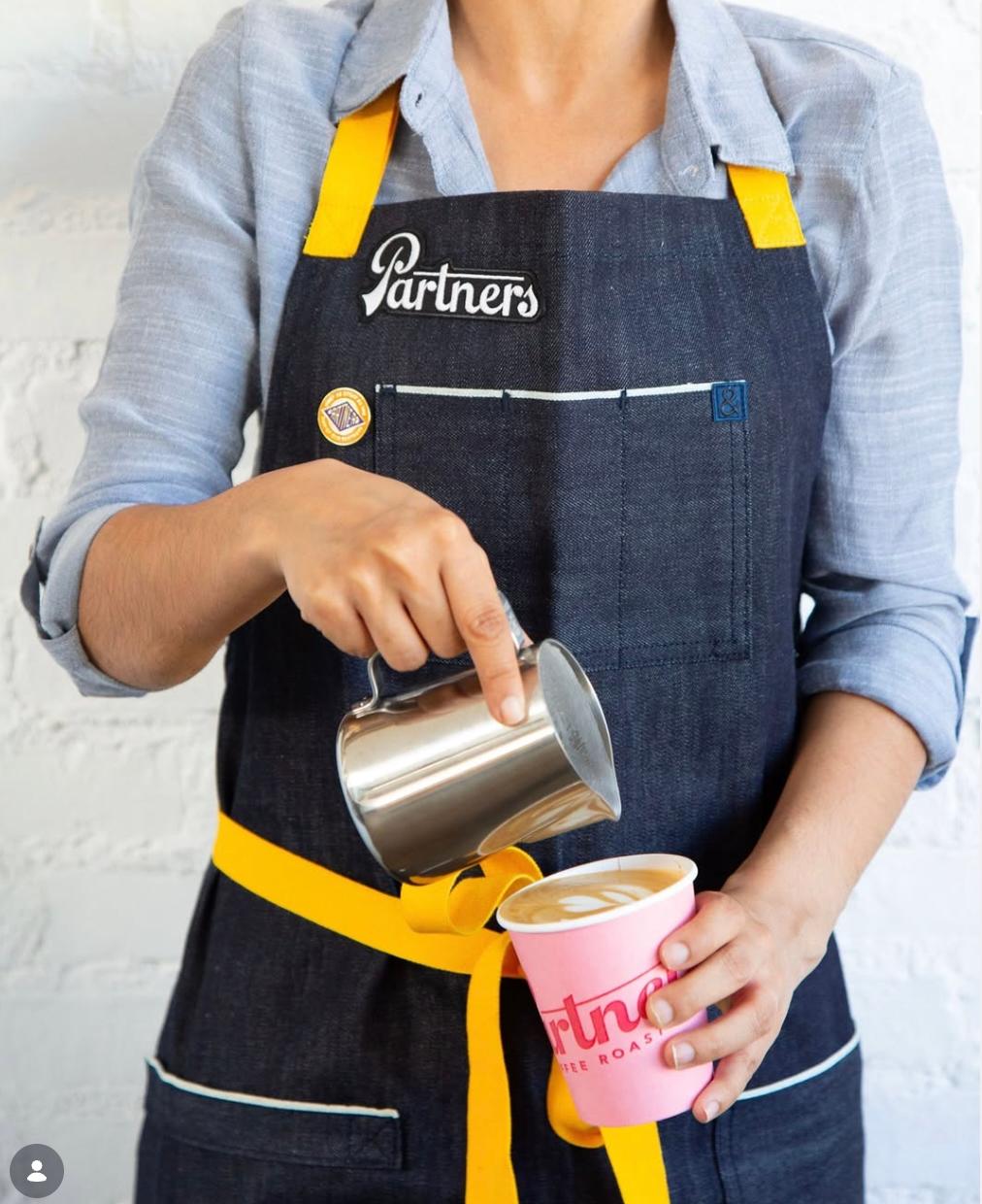 Partners Coffee pour, branding designed by Love & War for the Partners retail brand.