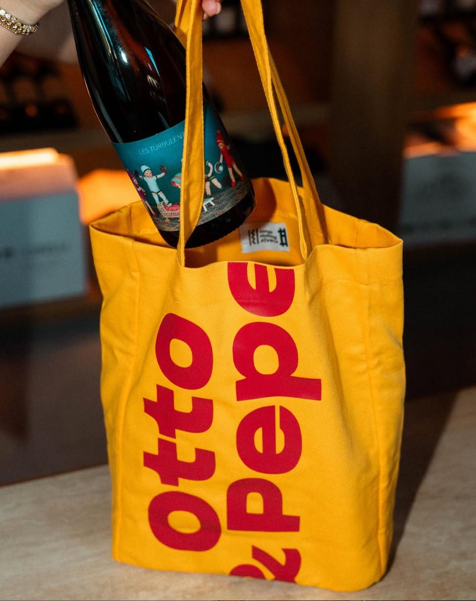 Otto & Pepe’s bold visual identity extends from the restaurant to its wine shop and branded merchandise. Love & War developed the Miami concept’s name, identity, packaging, and graphic system, including the oversized Otto & Pepe typography seen here on a custom wine tote. The playful branding reflects the restaurant’s distinctive mix of handmade pasta, natural wine, and contemporary Italian culture.