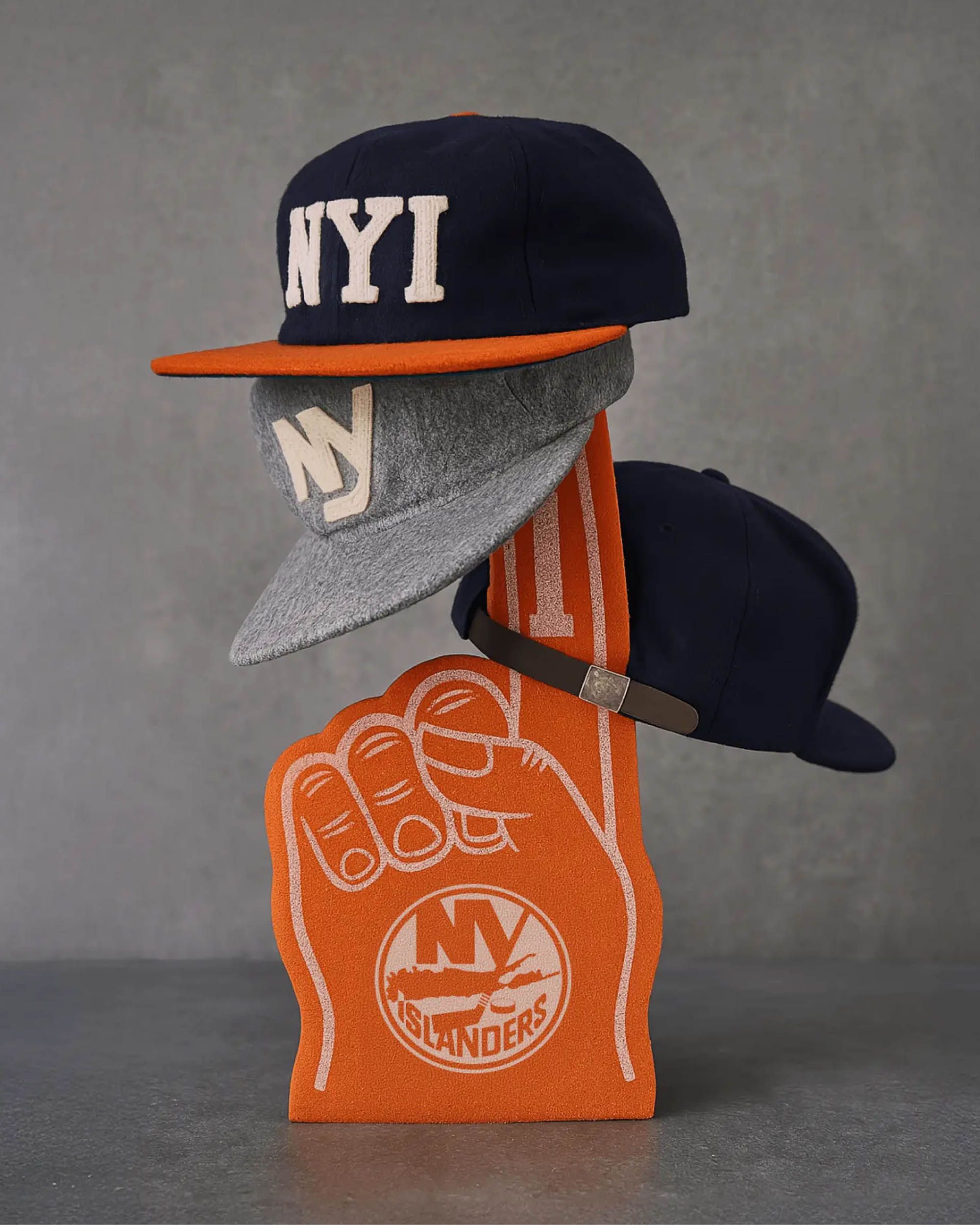 Custom New York Islanders hats and foam finger merchandise created for Isles Lab, the team’s retail concept at UBS Arena. Love & War developed the Isles Lab concept, naming, branding and merchandise program, creating a fashion and culture-driven approach to NHL fan apparel and New York Islanders merchandise.