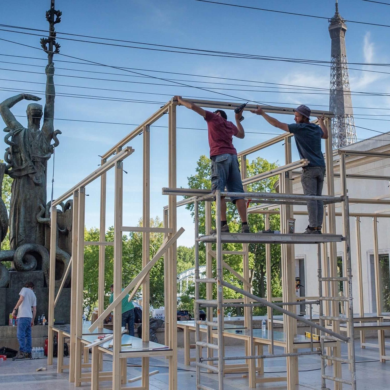 Construction of the EDO pop-up restaurant and dining pavilion in Paris, with the Eiffel Tower visible in the background. Love & War developed the brand strategy, visual identity and branded experience for EDO, Michelin-starred chef Mory Sacko’s traveling food concept, bringing the brand to life across its physical environment, apparel, merchandise and communications.