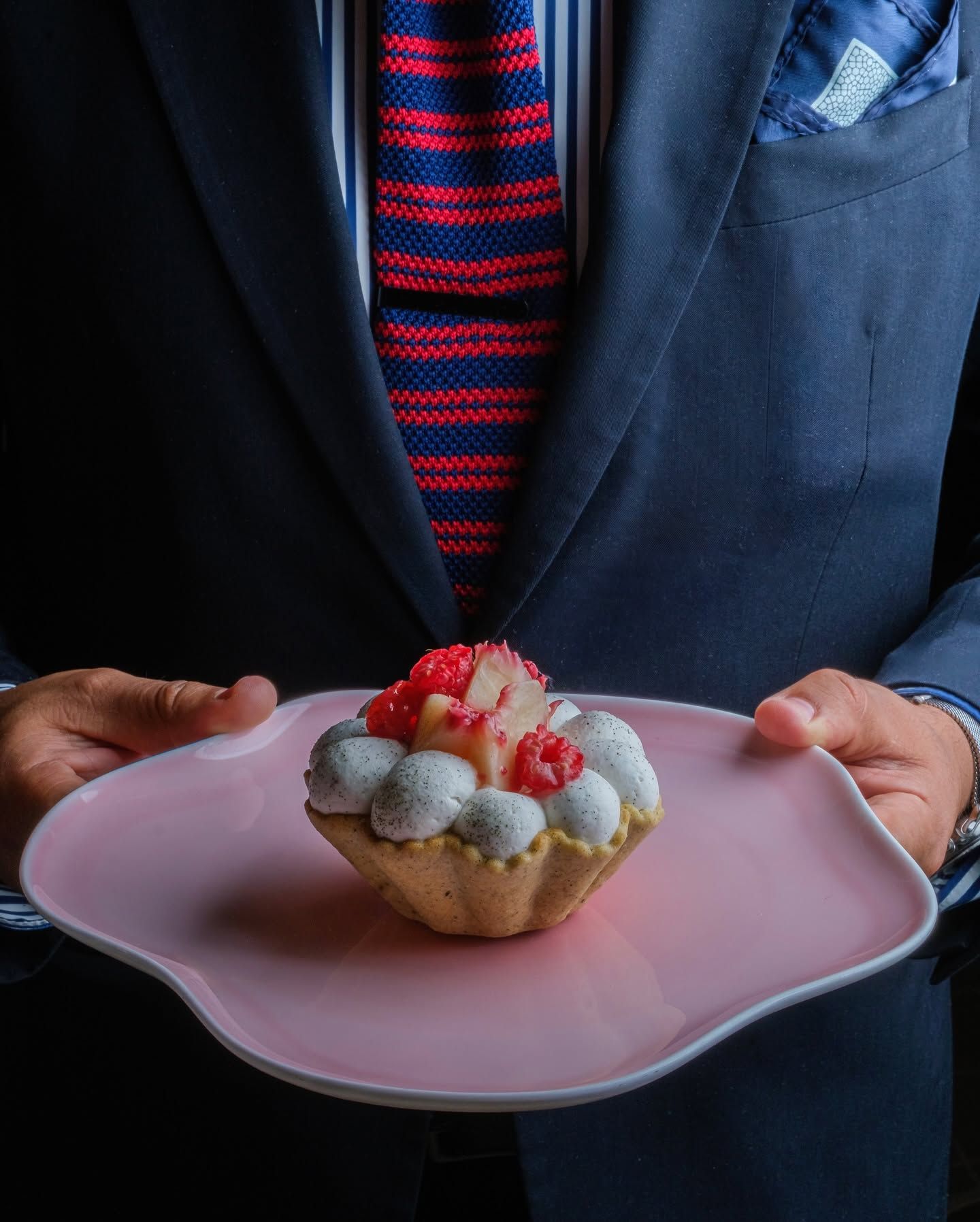 Le Pavillon dessert served on a sculptural pink plate, part of the dining experience at Daniel Boulud’s One Vanderbilt restaurant.