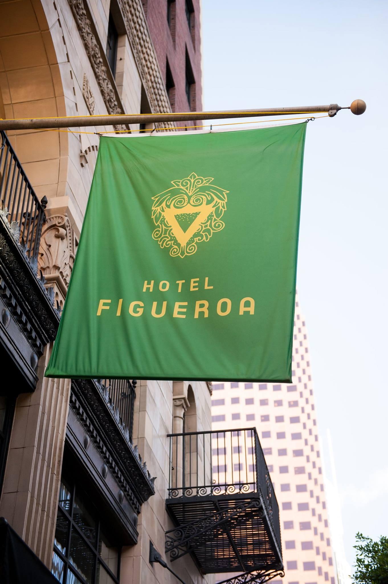 otel Figueroa exterior signage featuring the hotel’s custom logo and visual identity in Downtown Los Angeles (DTLA). Love & War developed the brand strategy, visual identity and guest materials for Hotel Figueroa, creating a distinctive hospitality brand inspired by the historic Los Angeles hotel’s architecture, cultural legacy and nearly century-long history.