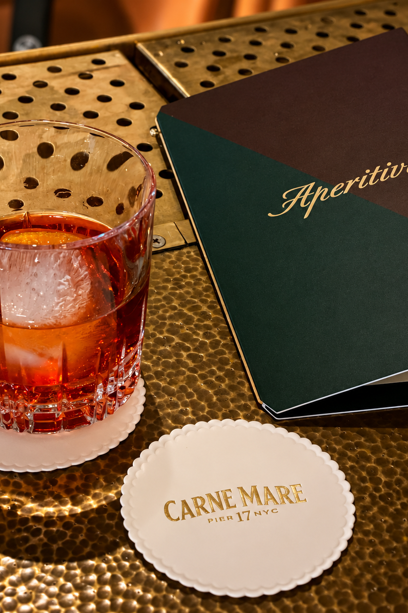 Carne Mare cocktail, branded coaster and Aperitivo menu showcasing the restaurant identity and materials designed by Love & War.