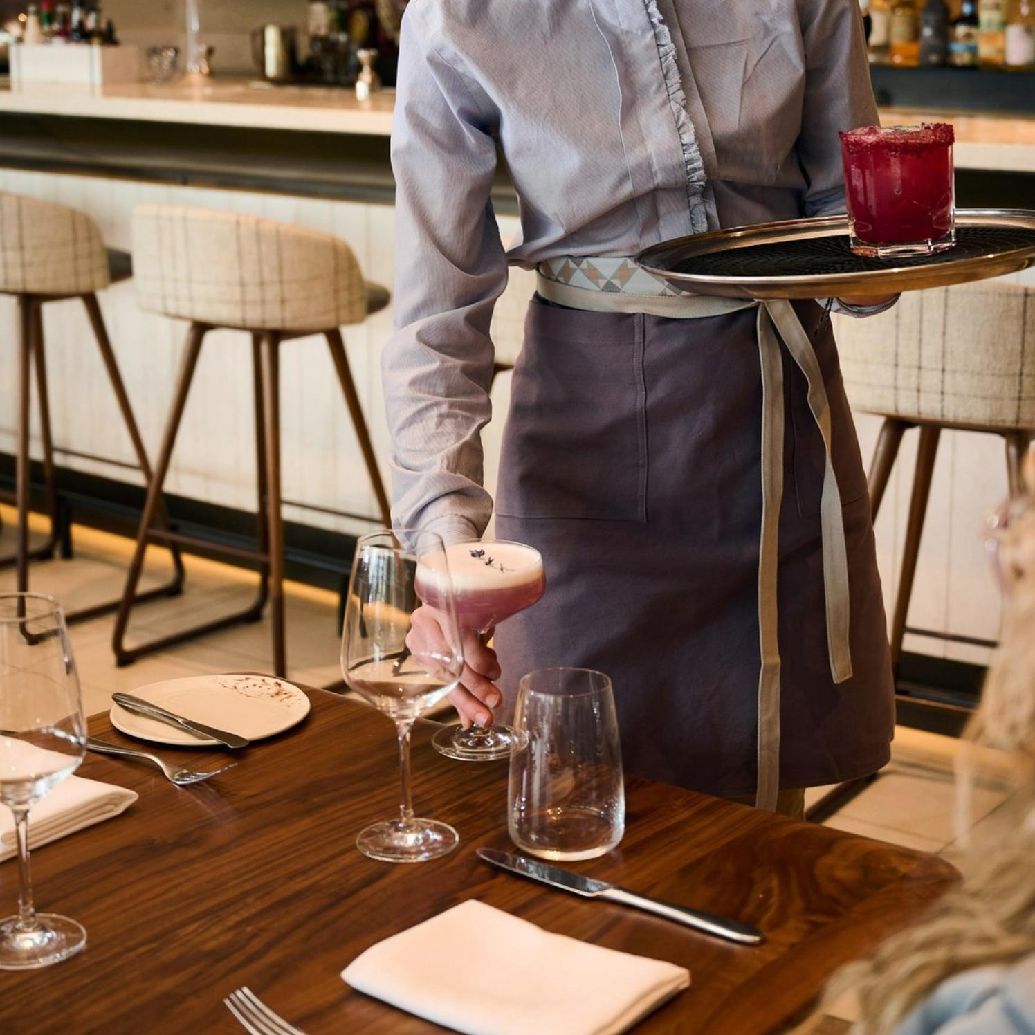 Custom hospitality uniforms created by Love & War for Drift, the signature restaurant at Muir Halifax. Designed as part of the restaurant's visual identity, the uniforms reinforce the luxury dining experience through bespoke apparel inspired by Nova Scotia's natural landscape and understated elegance.