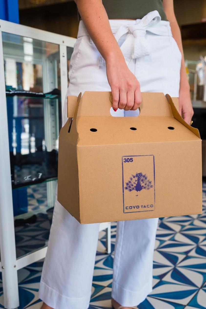 Coyo Taco takeout packaging in Wynwood, Miami, featuring custom branding and materials design by Love & War.