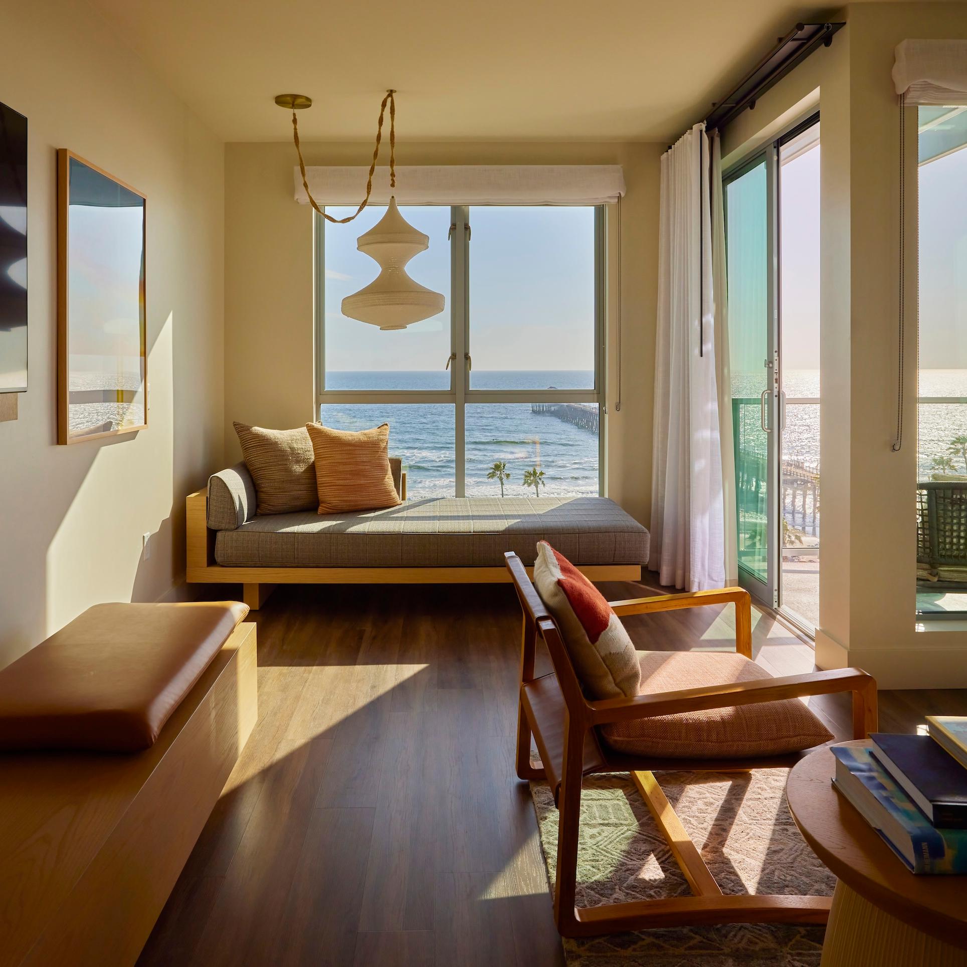 Ocean-view guest room at Mission Pacific Beach Resort in Oceanside, California, featuring warm natural materials, custom furnishings, and a relaxed coastal aesthetic. Love & War developed the hotel’s concept, naming, visual identity, experience design, and marketing, creating a hospitality brand inspired by Southern California living and Oceanside’s evolving creative culture.