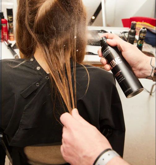 Dampen sectioned hair with a mist of water and then apply the Volume Thickening Spray from roots to ends.