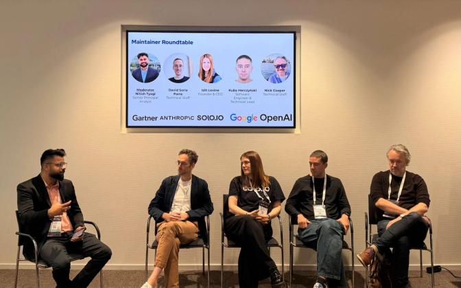 Five panelists seated on stage during a Maintainer Roundtable with speakers from Gartner, Anthropic, Solo.io, Google, and OpenAI.