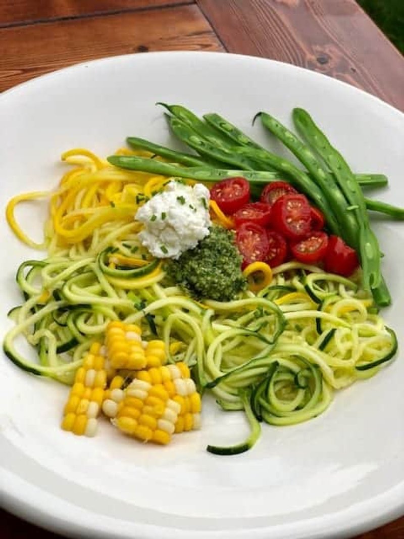 Zucchini Spaghetti with Macerated Tomatoes, Sweet Corn, Green Beans, and Pesto
