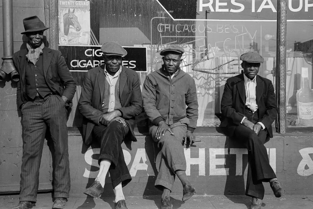 Men after the great migration sitting outside store