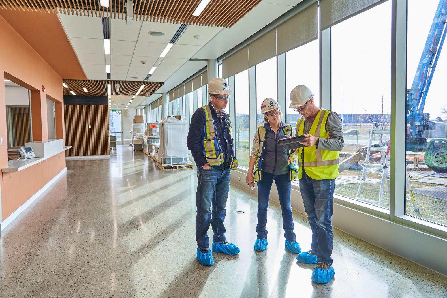 Workers looking at plans