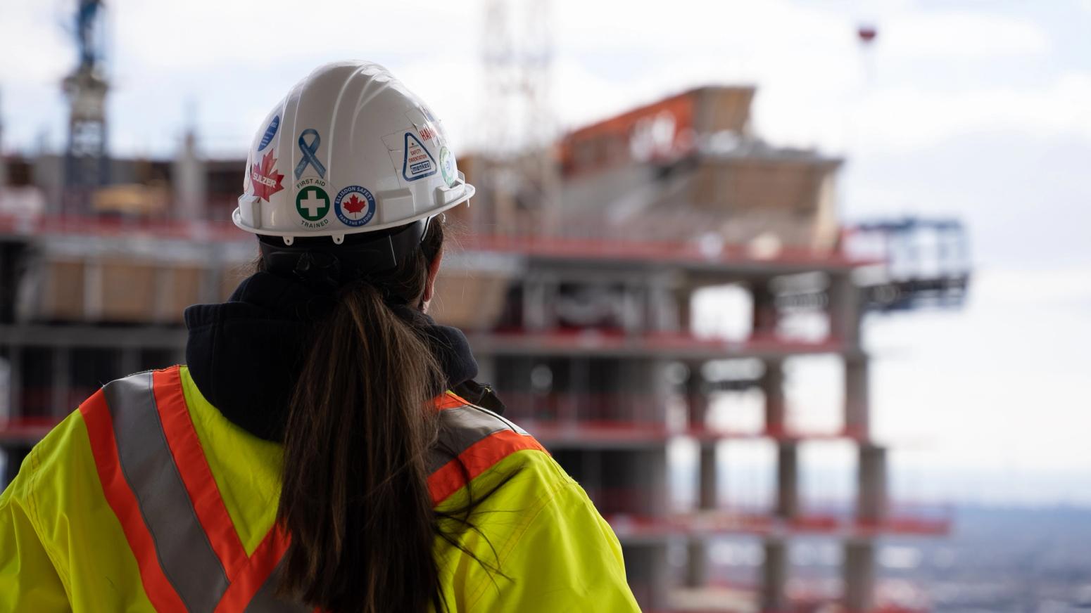 Worker overlooking construction site