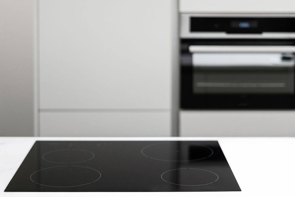 A newly installed electric oven and cooktop wired to Australian safety standards.
