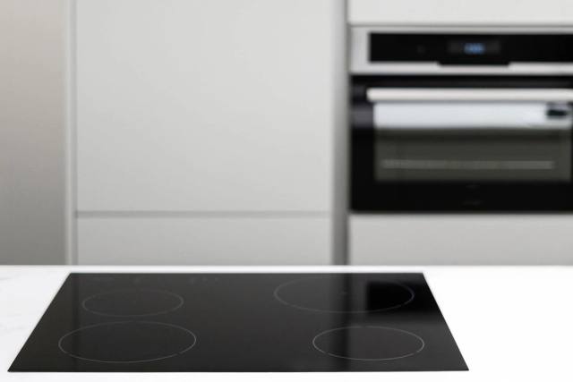 A newly installed electric oven and cooktop wired to Australian safety standards.