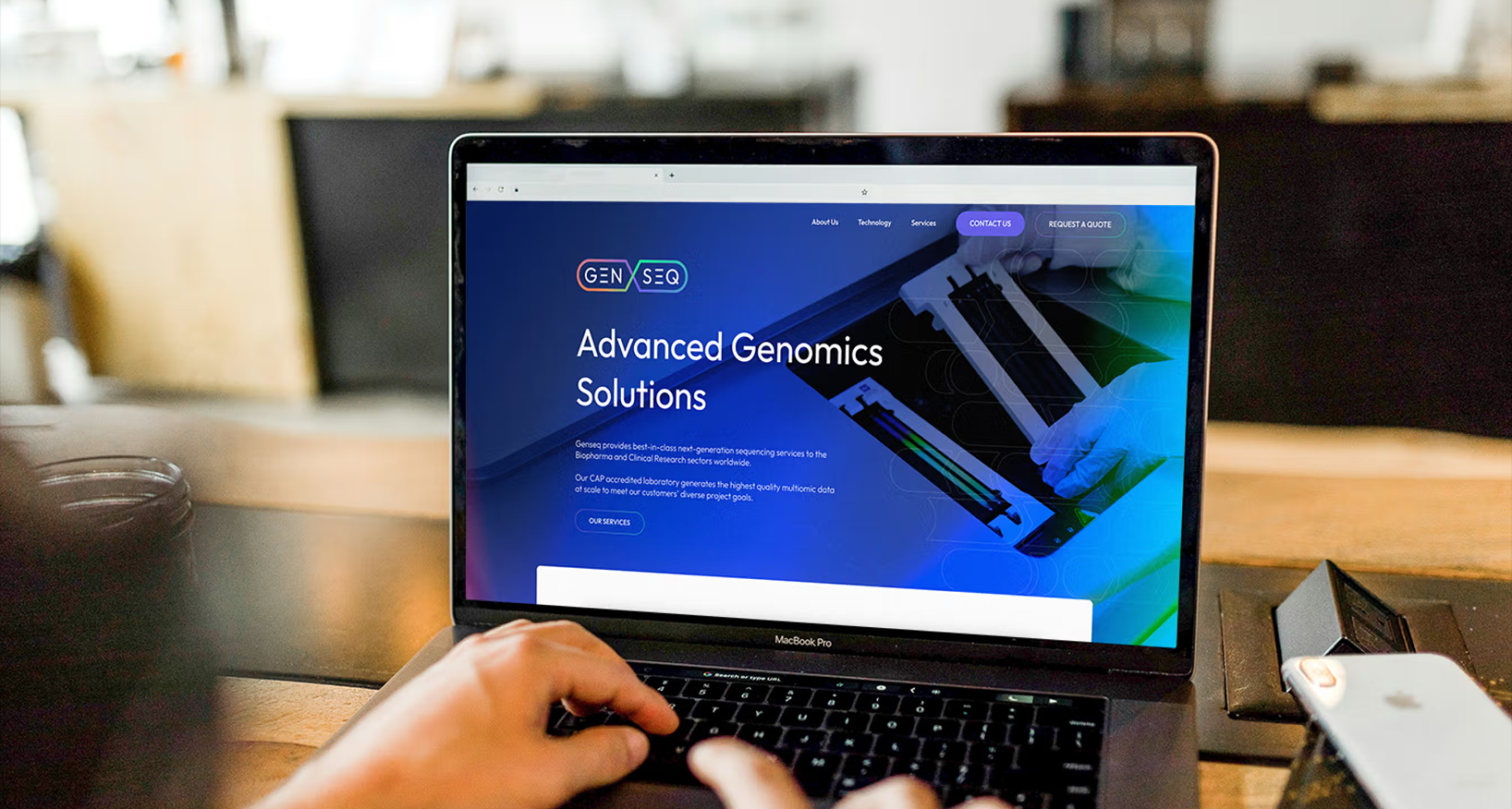 View of someone at a laptop looking at the Genseq website