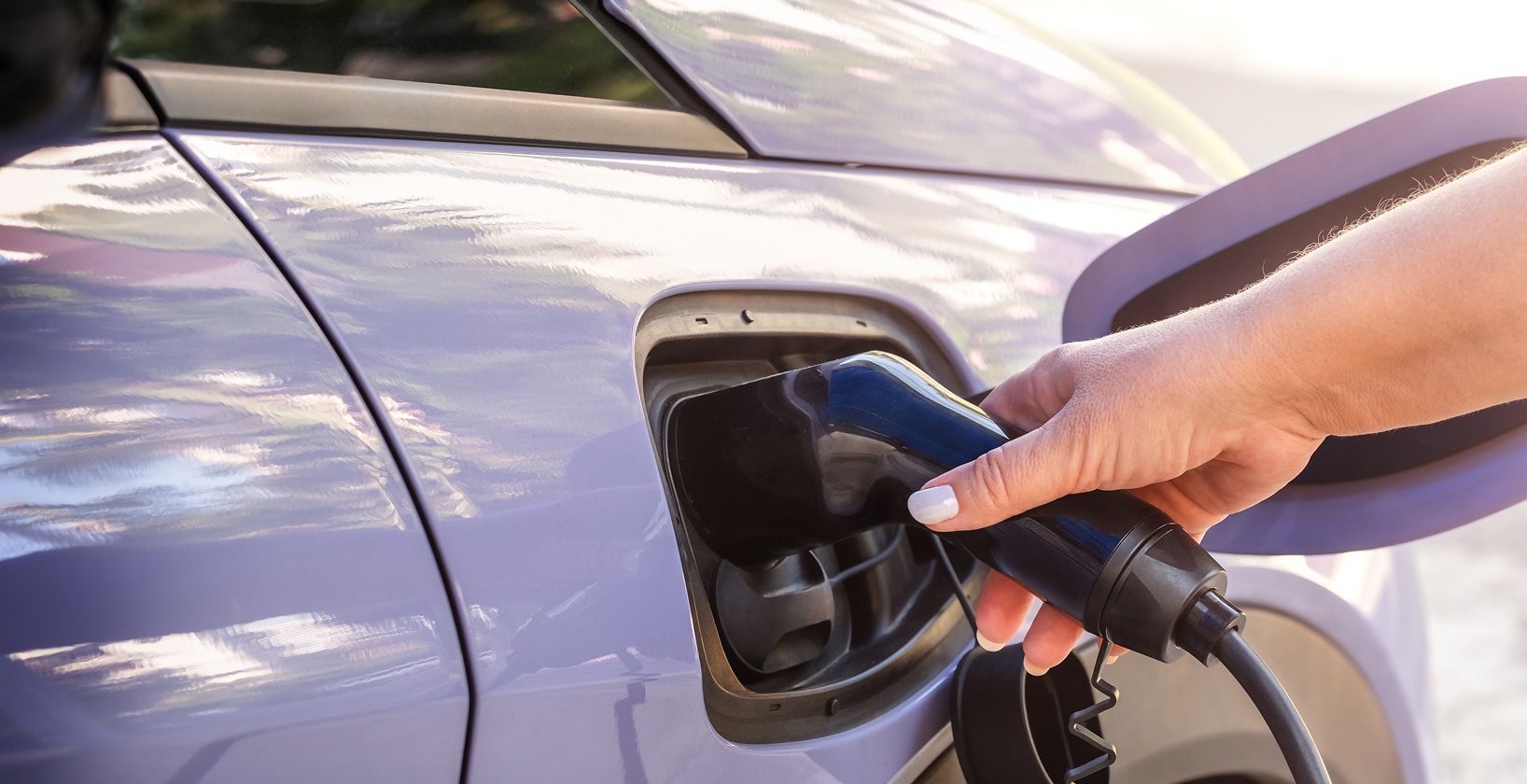 woman filling car with petrol