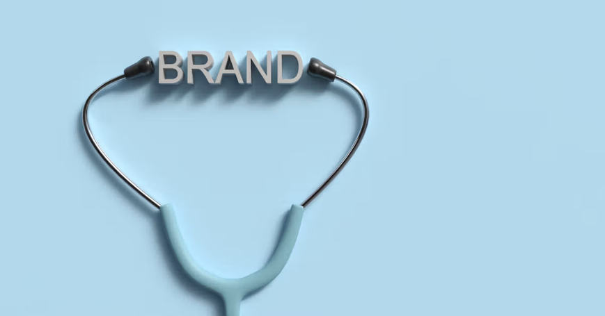 stethoscope on blue background with the word brand between ear pieces