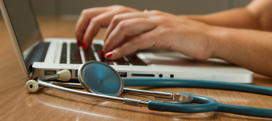 doctors-hands-typing-on-laptop
