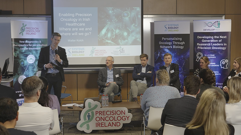 View of crowd watching speakers on stage for healthcare event