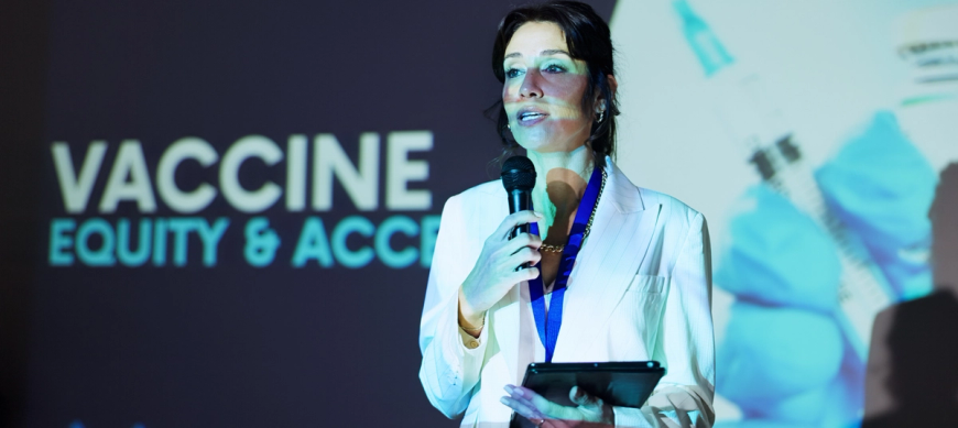 Woman speaking at vaccine conference