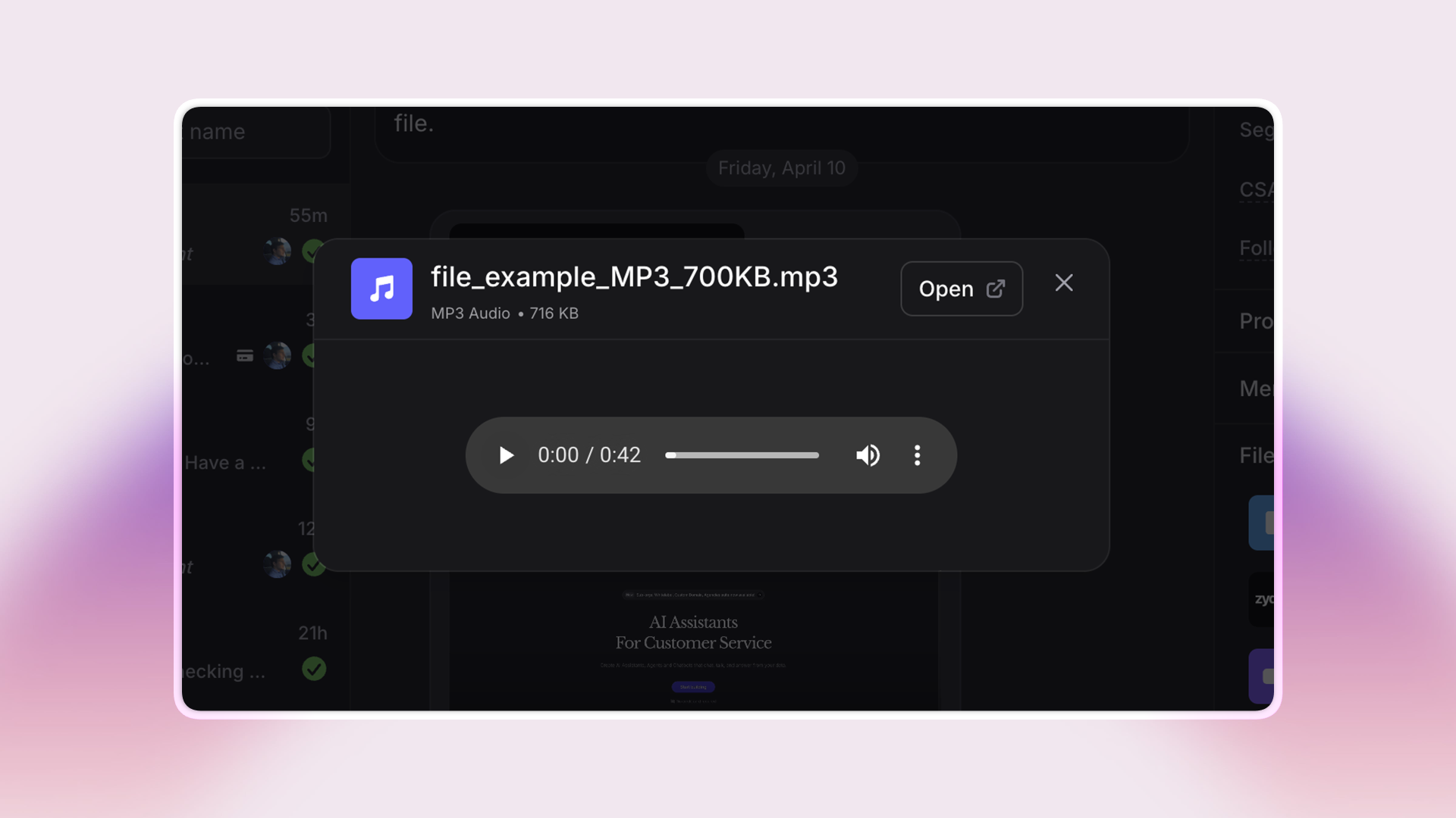 Screenshot of an audio file preview within the Invent chat interface. The file, named “file_example_MP3_700KB.mp3,” is shown in a popup with an audio player bar, file details (MP3 Audio, 716 KB), a play button, volume control, and an “Open” link, all against a dark background with chat messages visible in the background.
