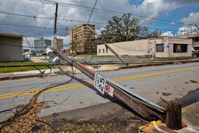 Hurricane Laura's 150-mph winds snapped utility poles down in Lake Charles. Photo: Julie Dermansky.