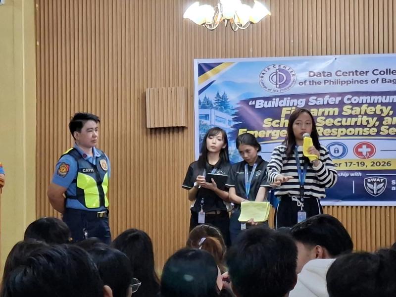Panel of speakers, including a police officer and DCCP representatives, addressing the seated audience during the seminar