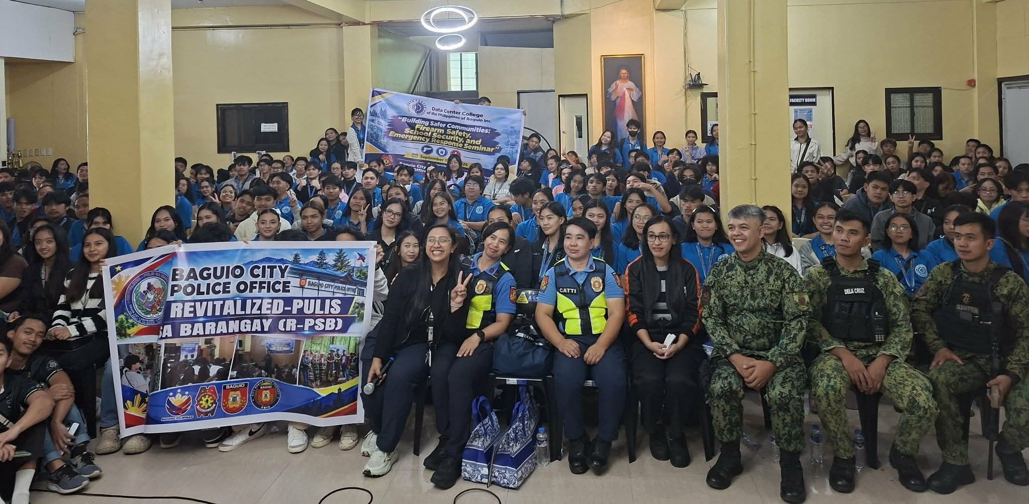 Seminar participants, DCCP officials, and Baguio City Police personnel pose for a group photo holding a Revitalized Pulis sa Barangay banner