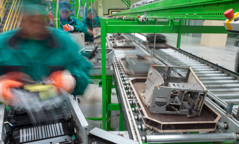 broken tech on a conveyer belt