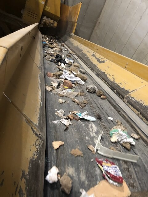 waste on a conveyer belt