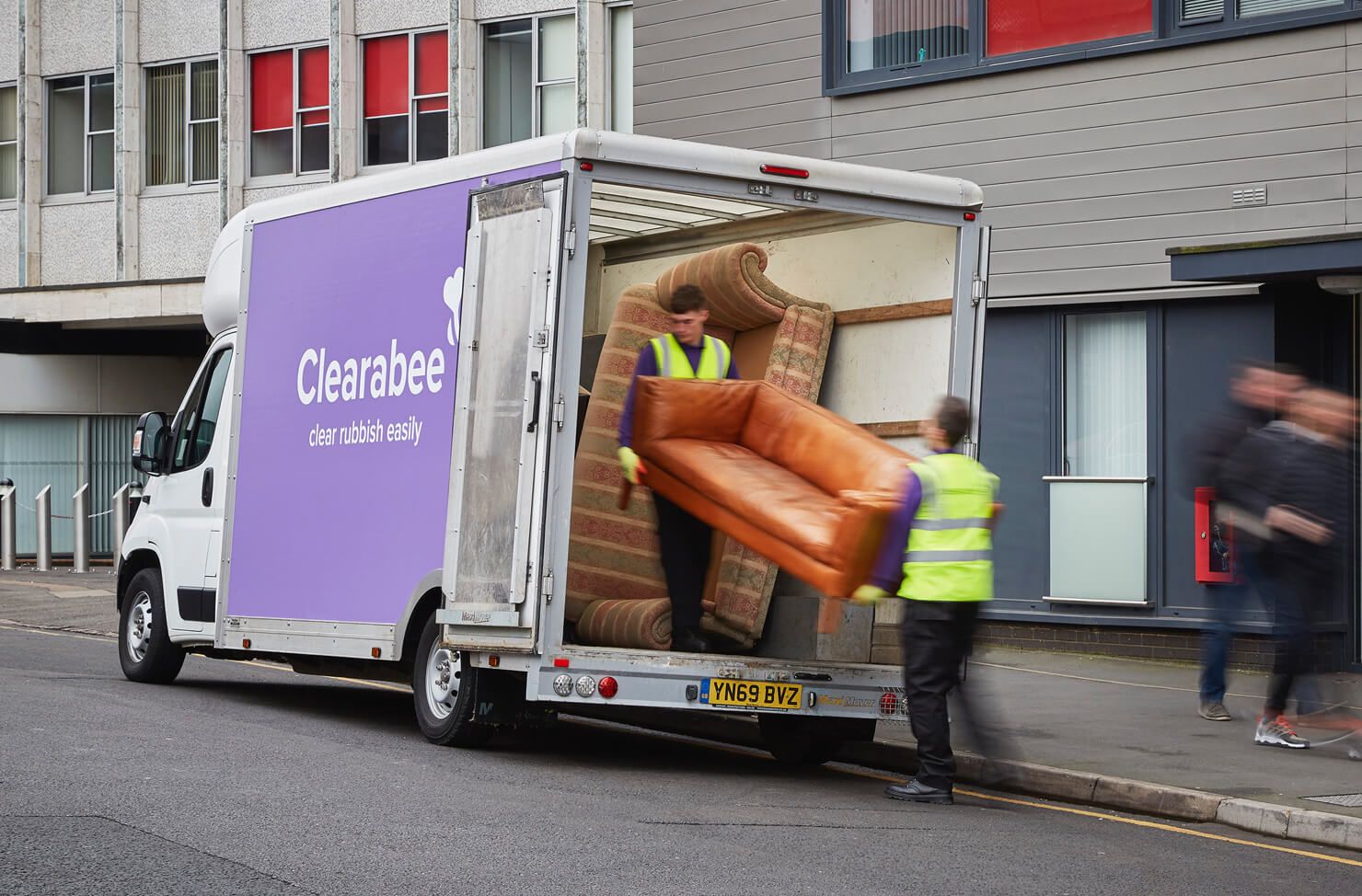 sofa loaded into a van