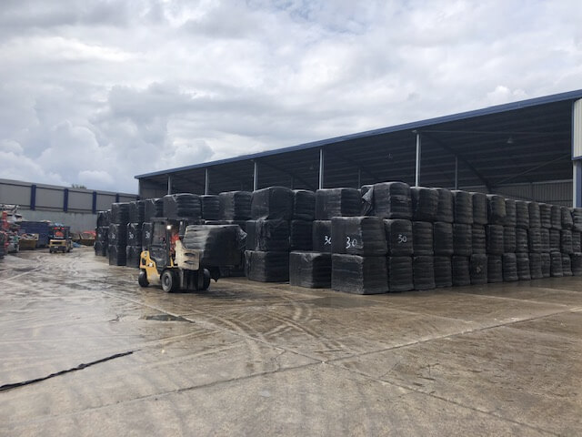 waste being moved by a forklift