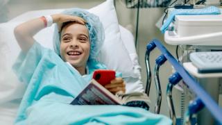Boy in hospital bed