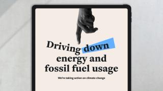 Tablet showing message of 'Driving down energy and fossil fuel usage'.