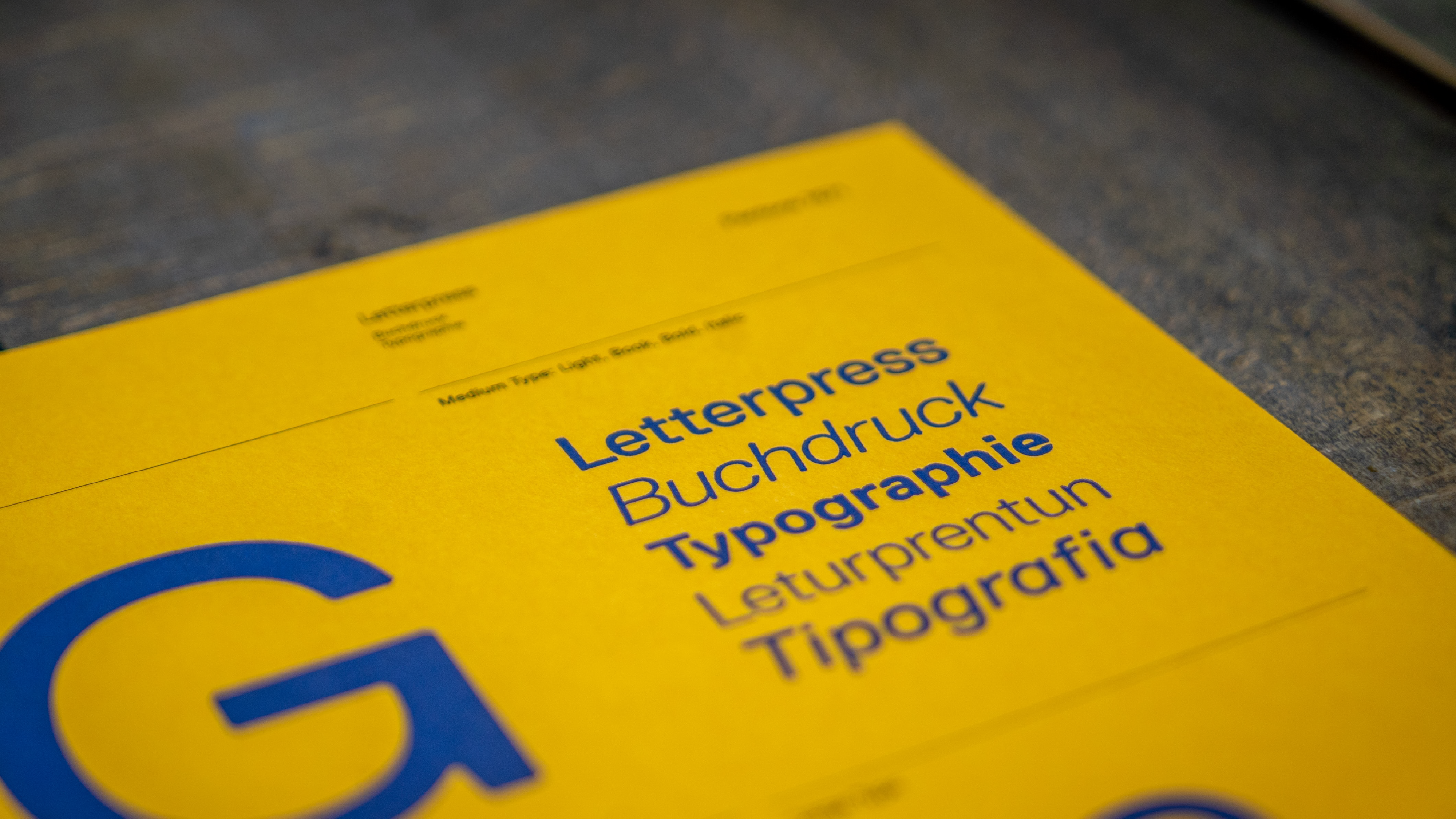 Various fonts printed on a yellow page