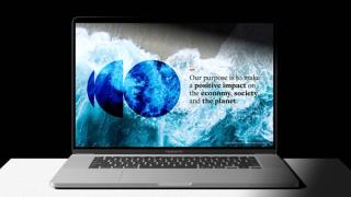 Laptop with text 'Our purpose is to make a positive impact on the economy, society and the planet'