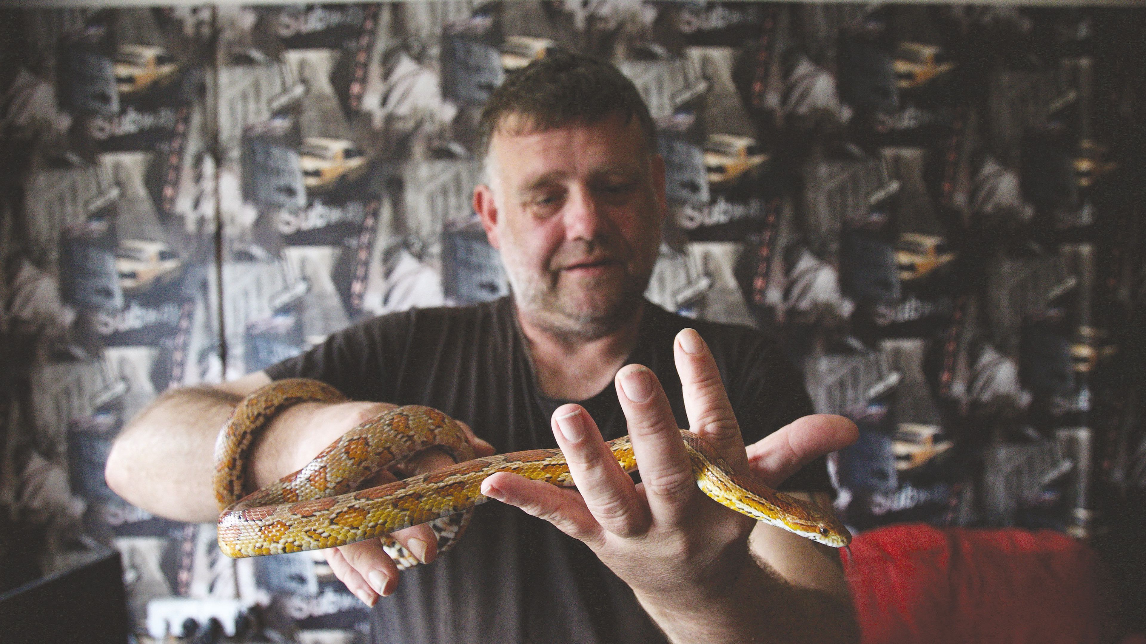 Photo of person with a snake from the Paige book