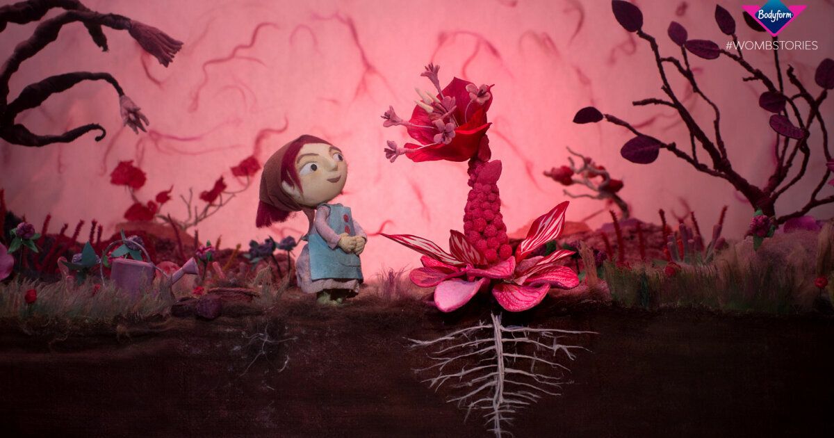 cartoon women in front of red flower