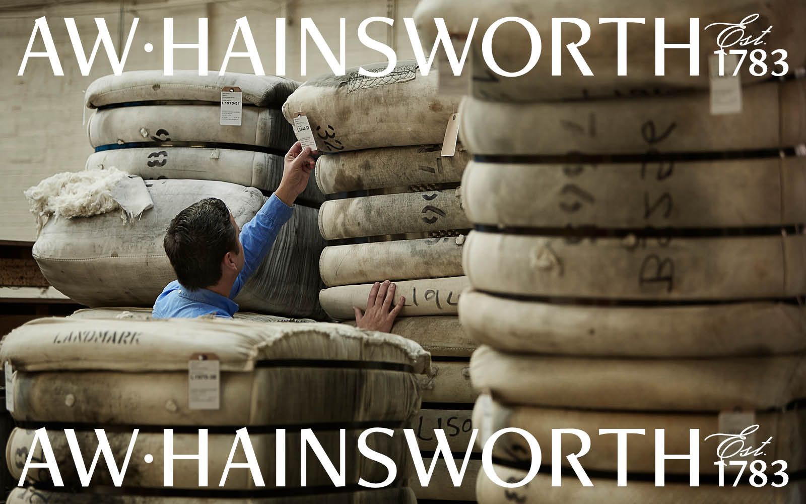 Man inspecting wool with AW Hainsworth logo overlayed