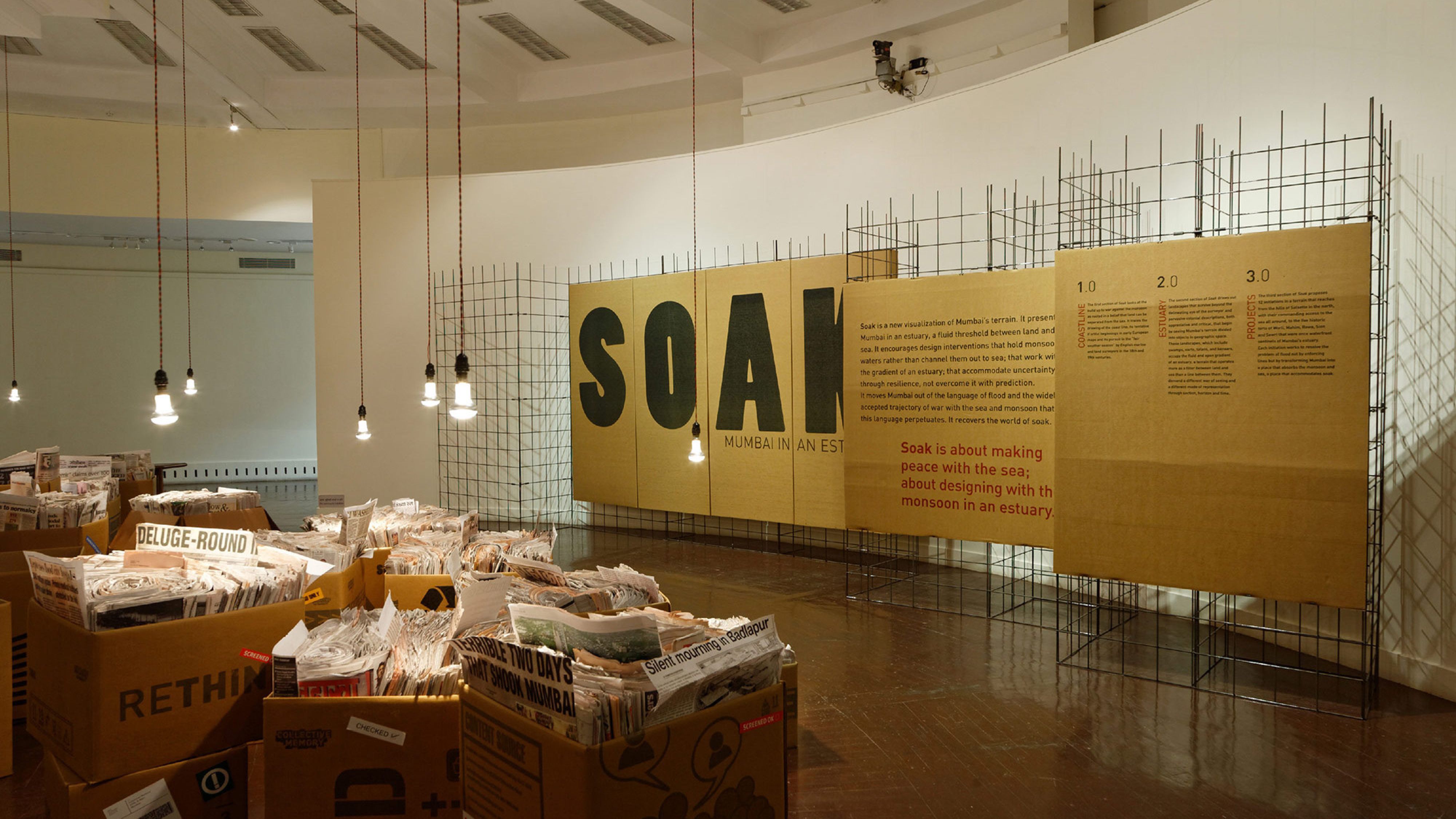 SOAK exhibition - Gallery with boxes full of newspapers