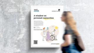 Woman walking in front of poster with the text A Window on personal connection