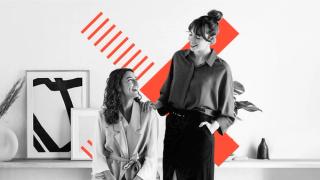 Photo of two people with Creative Labs logo behind