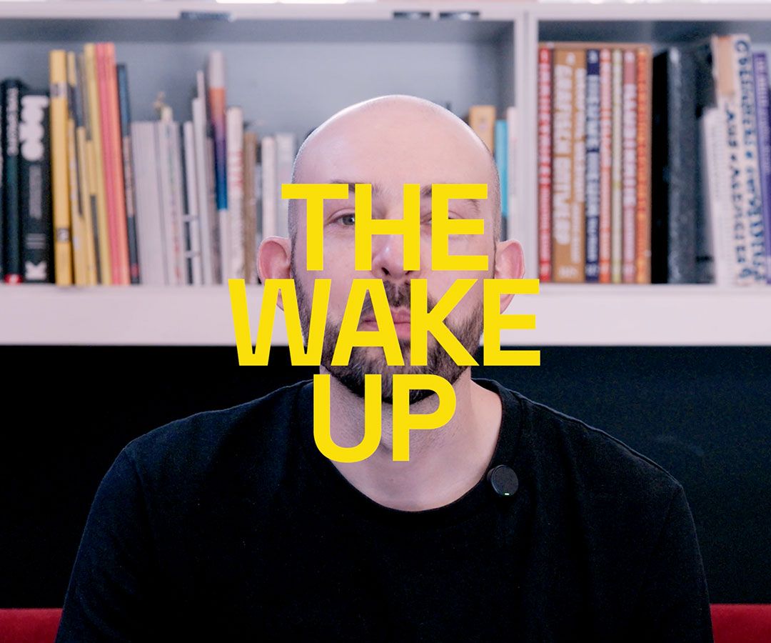 The Wake Up text over an image of Chris sat in the studio