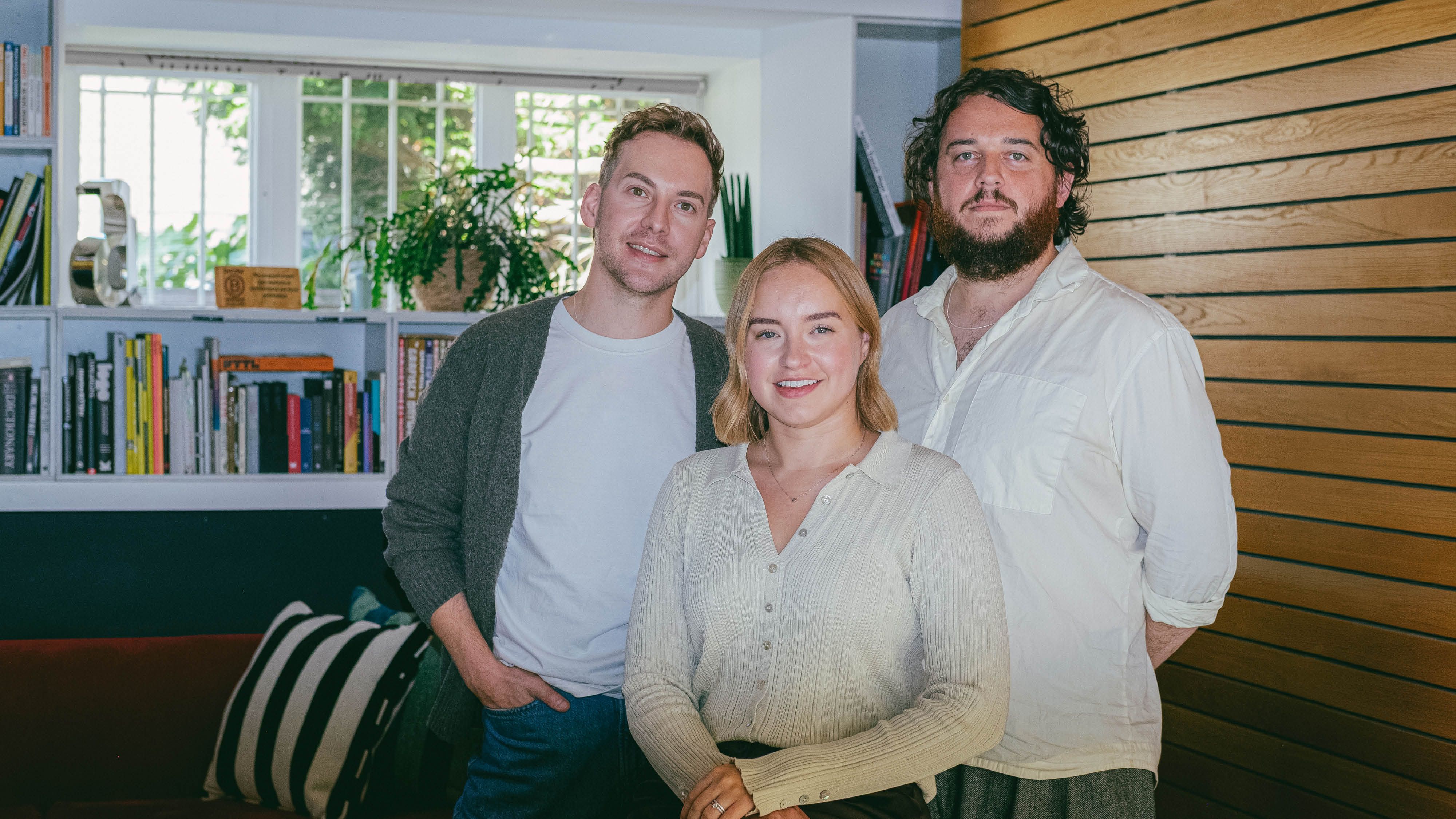 Joss Ward, Em Blalock and Erik Winterburn stood together in the studio