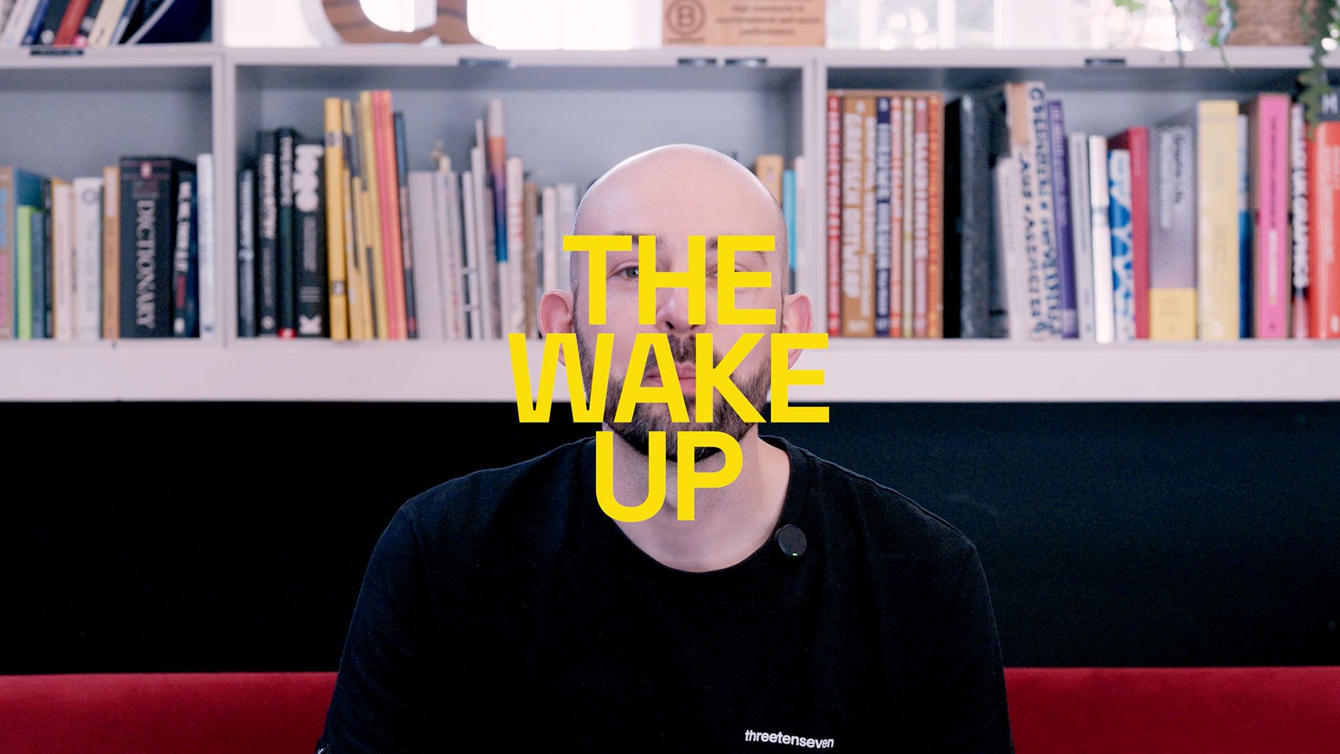 The Wake Up text over an image of Chris sat in the studio