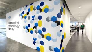 Wall graphic reading Pioneering Technology for Life