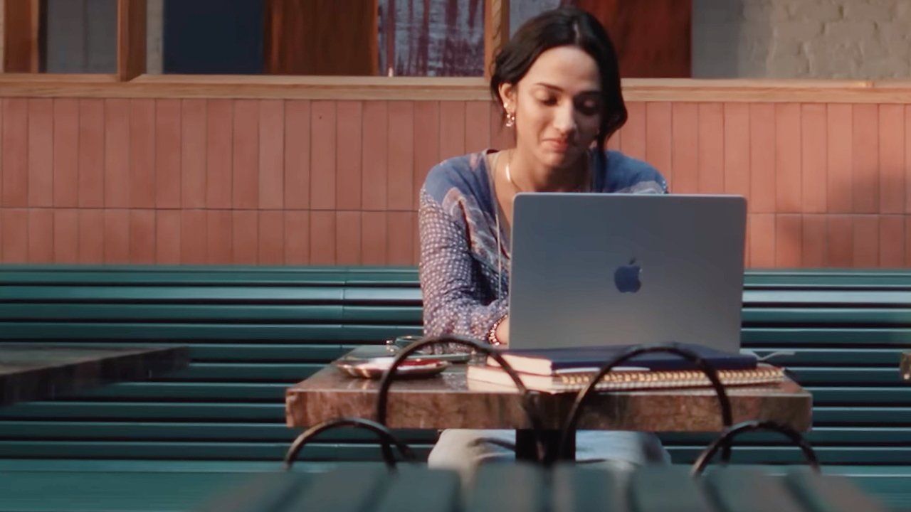 still from recent Mac ad showing student working on mac book laptop