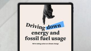 Tablet showing message of 'Driving down energy and fossil fuel usage'.