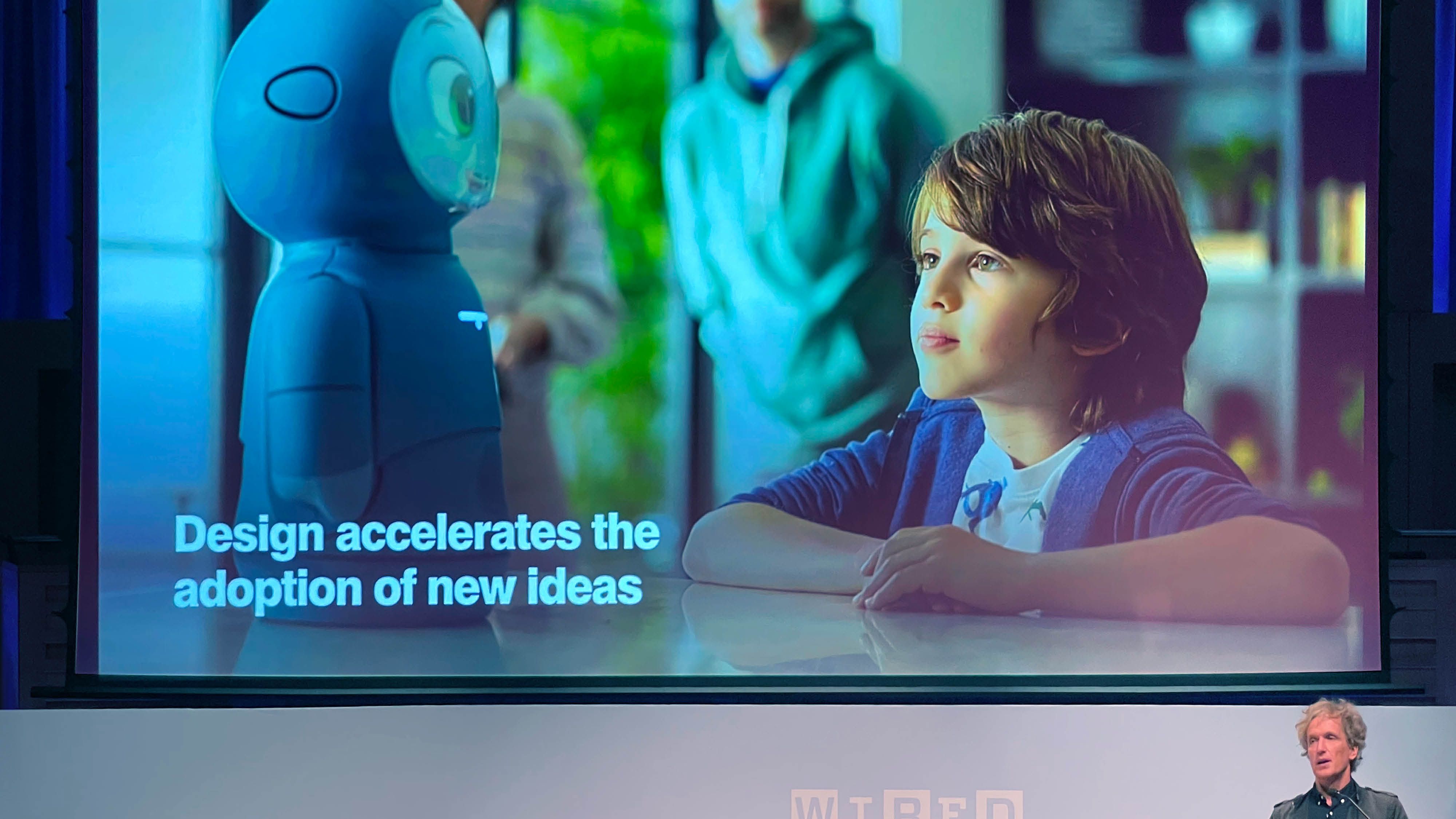 Yves from fuseproject presenting a slide stating 'Design accelerates the adoption of new ideas'
