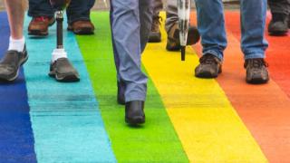 Closeup of legs on rainbow crossing